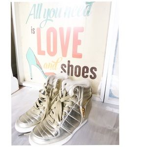 Gold platform sneakers.